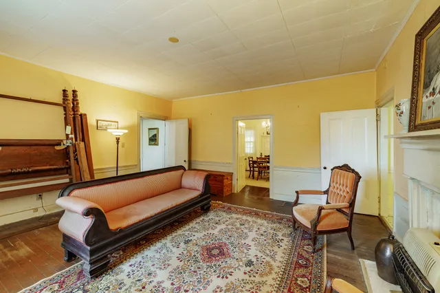 a living room with furniture and a rug