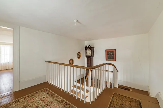 a view of a hallway with a bedroom