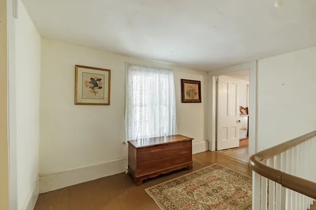 a bedroom with furniture and window