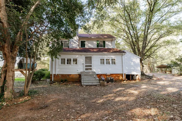 a view of house with outdoor space