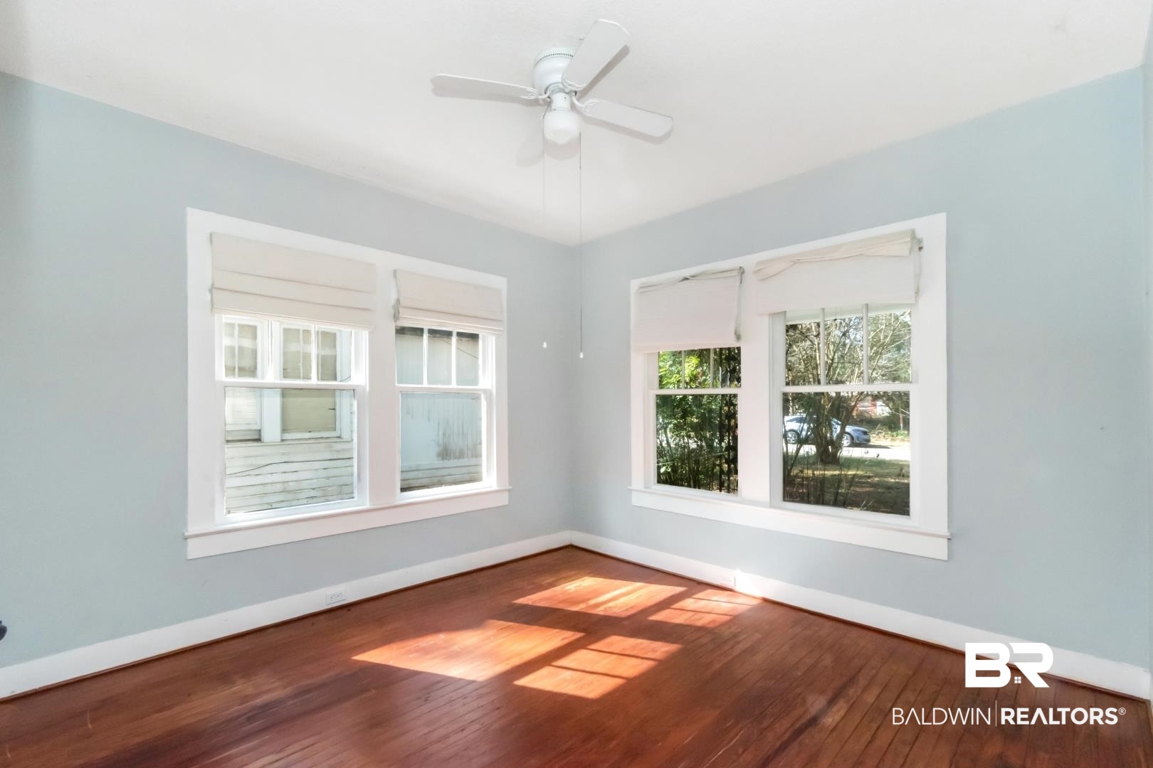 731 Jemison Street Mobile, AL 36606 - Photo 10 of 27 Unfurnished room with wood-type flooring and a ceiling fan