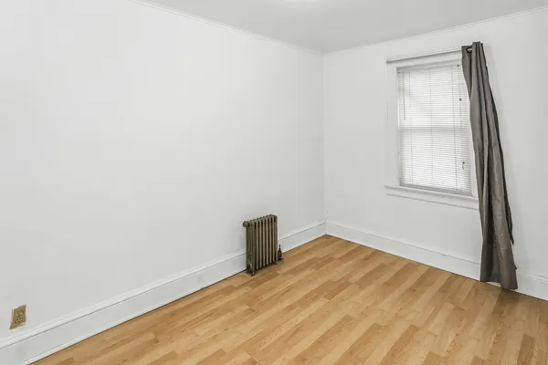 a view of a hallway with a white walls