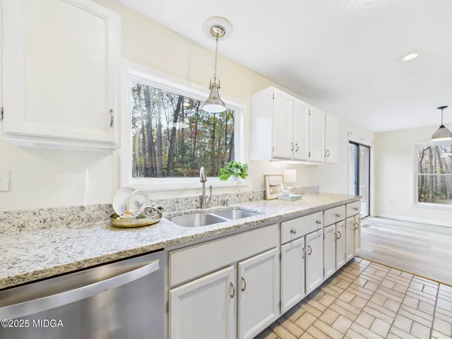 a kitchen with sink and window