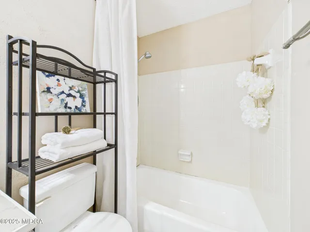 a view of backyard with a deck and wooden floor