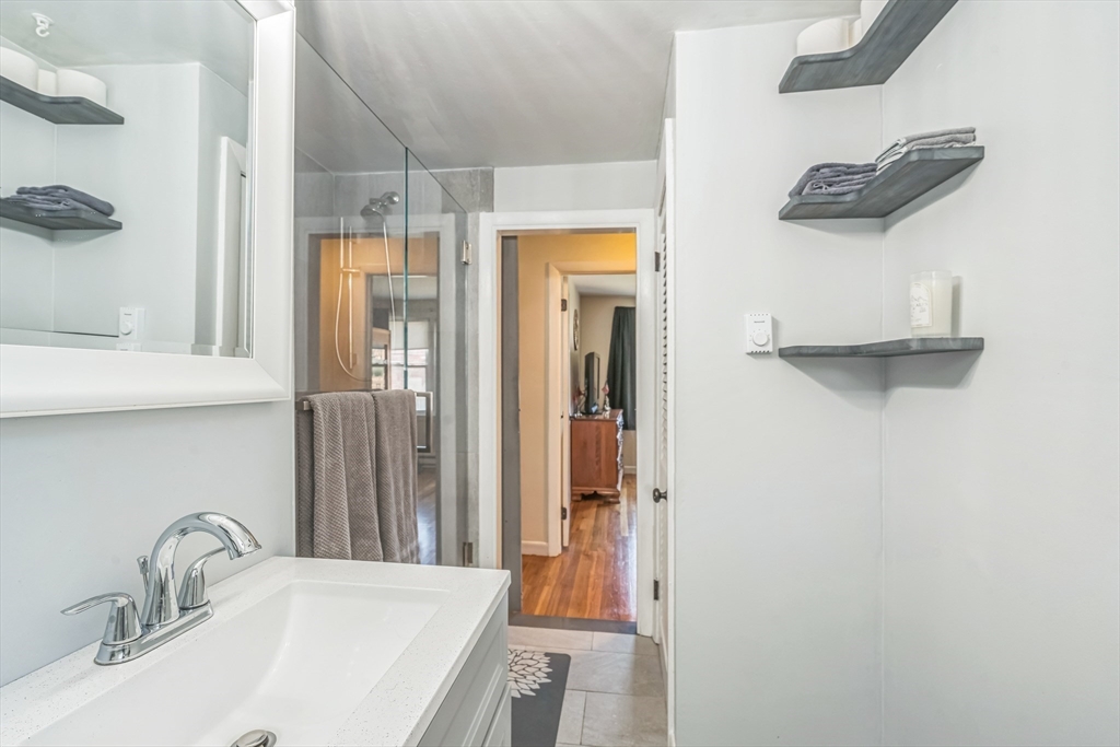156 Andover Road Billerica, MA 01821 - Photo 12 of 22 a bathroom with a sink and a mirror