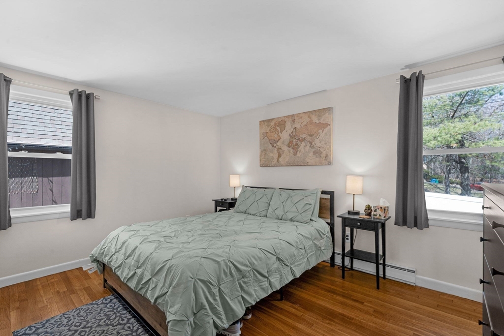 156 Andover Road Billerica, MA 01821 - Photo 13 of 22 a bedroom with a bed and wooden floor