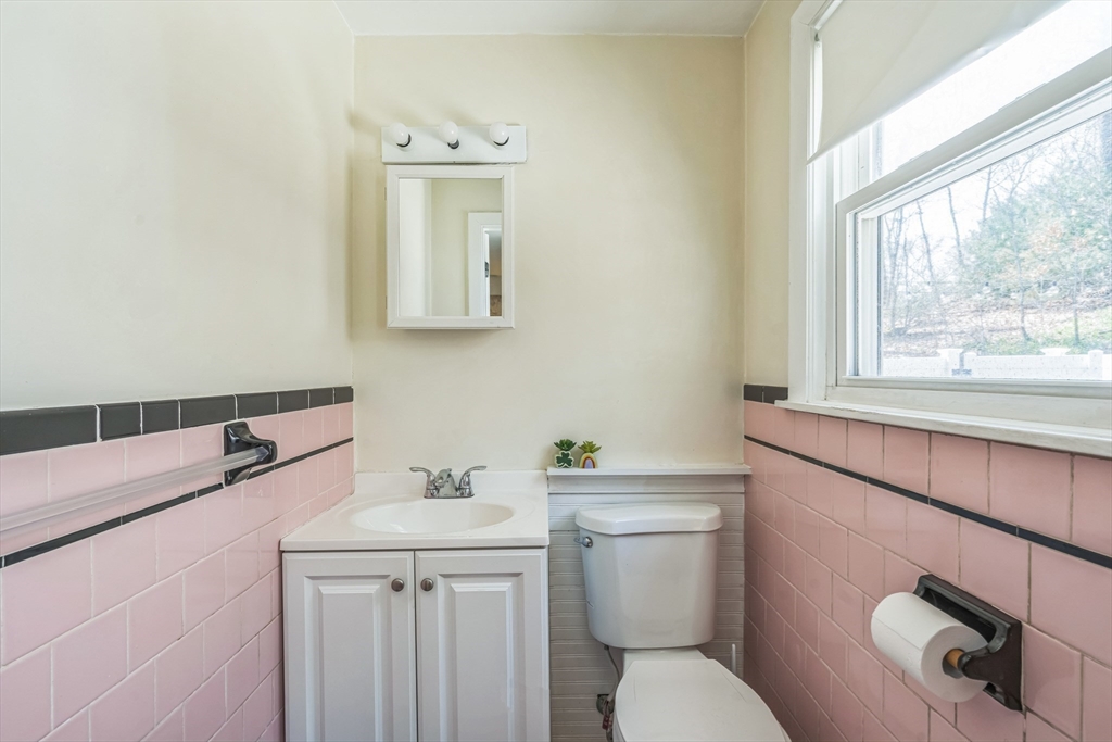 156 Andover Road Billerica, MA 01821 - Photo 16 of 22 a bathroom with a toilet sink and mirror