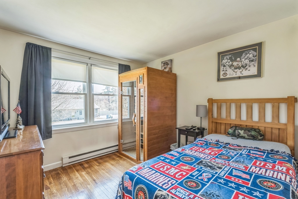 156 Andover Road Billerica, MA 01821 - Photo 17 of 22 a bedroom with a bed a dresser and a window