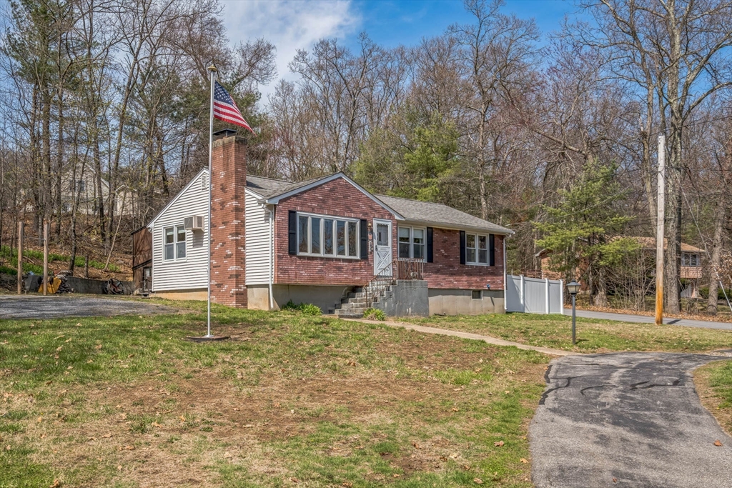 156 Andover Road Billerica, MA 01821 - Photo 2 of 22 a front view of a house with a yard