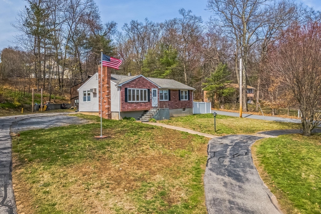 156 Andover Road Billerica, MA 01821 - Photo 21 of 22 a view of a house with a big yard and large trees