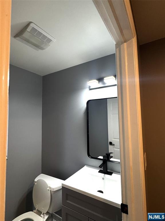 233 Warren Avenue, Unit B Fort Lee, NJ 07024 - Photo 6 of 11 a bathroom with a sink and a mirror