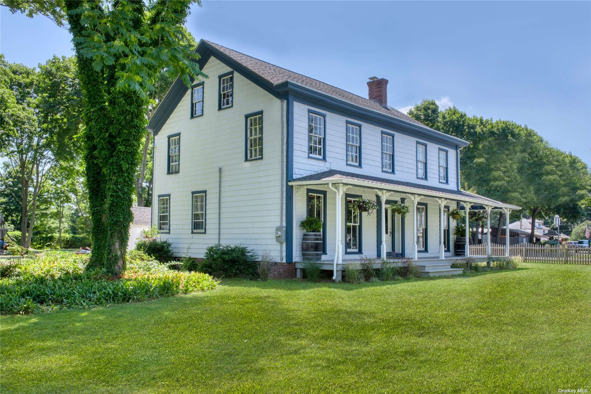 50 Main Road Laurel, NY 11948 - Photo 1 of 1 a front view of a house with a yard