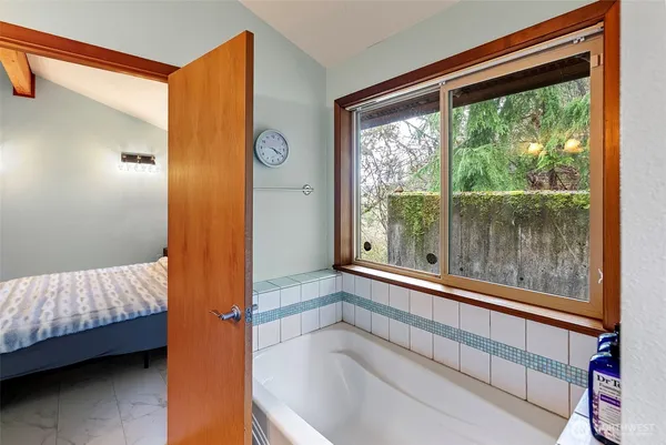 a view of room with window and furniture