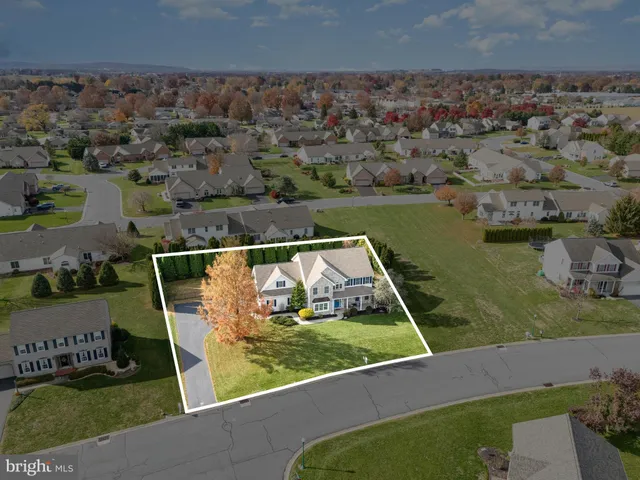 an aerial view of a house with a garden