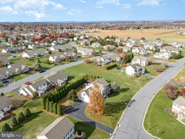 an aerial view of a house with a lake view