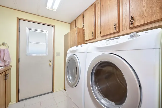 a utility room with dryer and washer