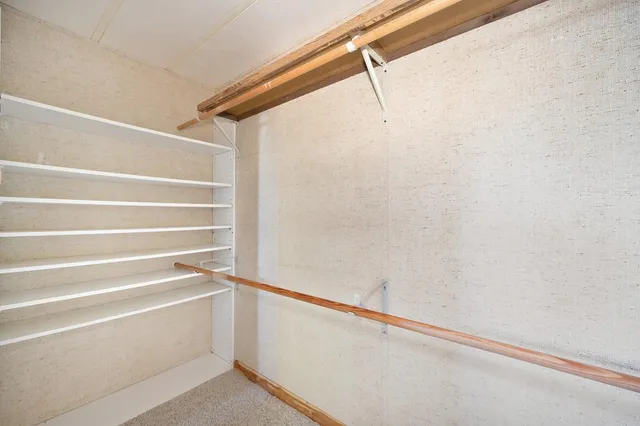 a view of an empty walk in closet