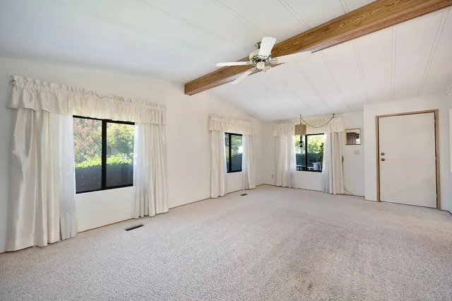 a view of a patio with wooden floor