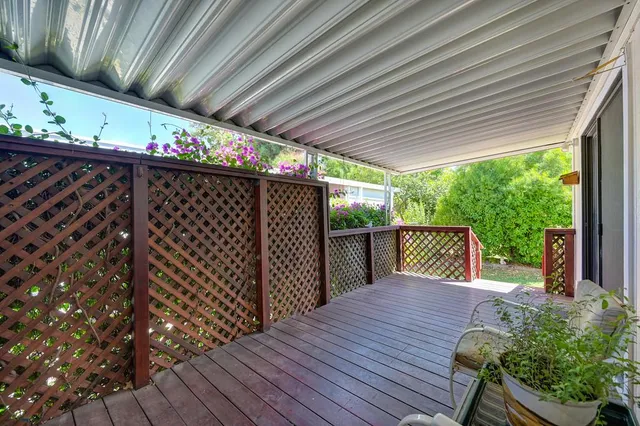 a chair and table in a room next to a window