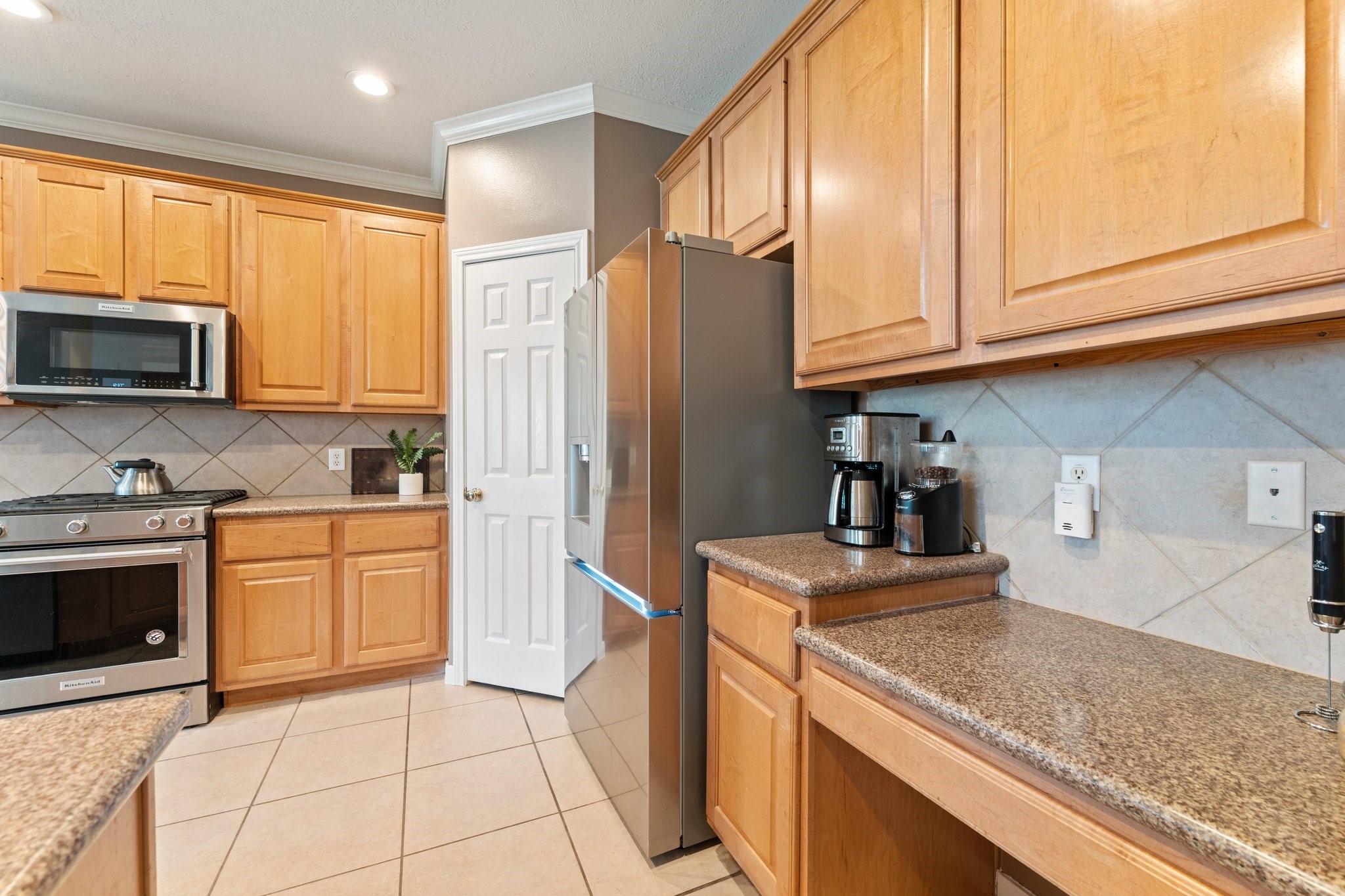 25447 China Springs Spring, TX 77373 - Photo 11 of 45 This flexible space can be used to get your mornings started as a coffee bar or desk space to work in.