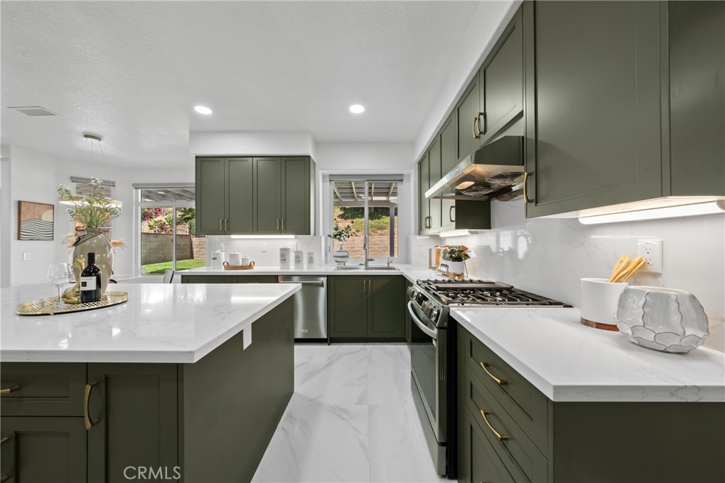 21111 Stockton Pass Road Walnut, CA 91789 - Photo 11 of 33 a kitchen with a sink stove and cabinets