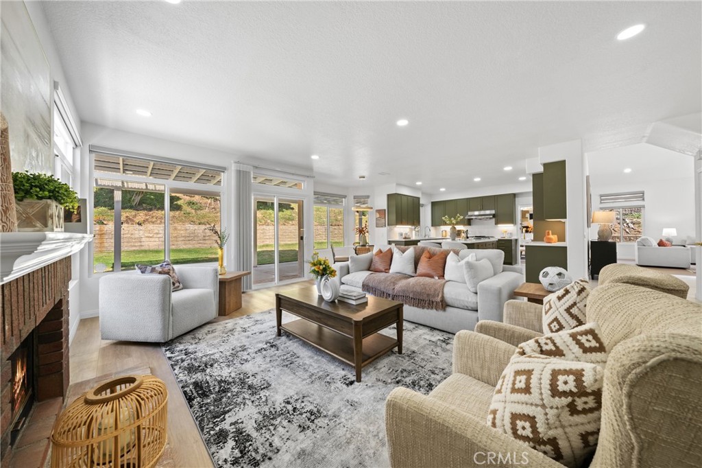 21111 Stockton Pass Road Walnut, CA 91789 - Photo 13 of 33 a living room with furniture wooden floor and a fireplace