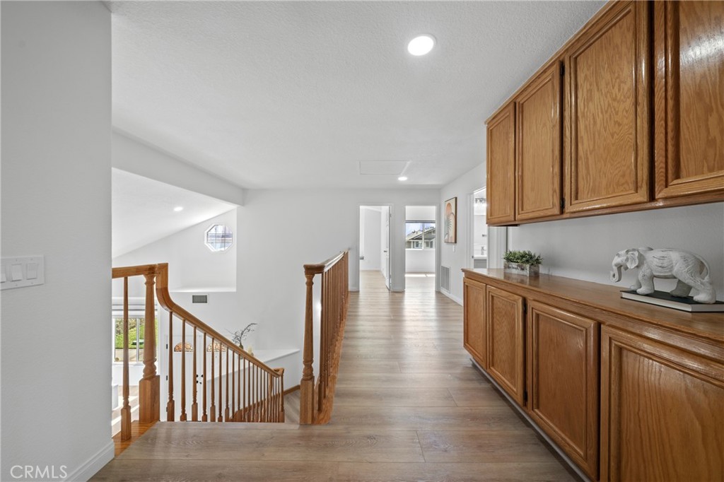 21111 Stockton Pass Road Walnut, CA 91789 - Photo 22 of 33 a view of a kitchen with wooden floor and stairs