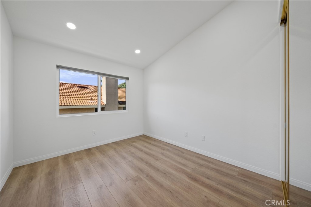 21111 Stockton Pass Road Walnut, CA 91789 - Photo 25 of 33 a view of an empty room with wooden floor