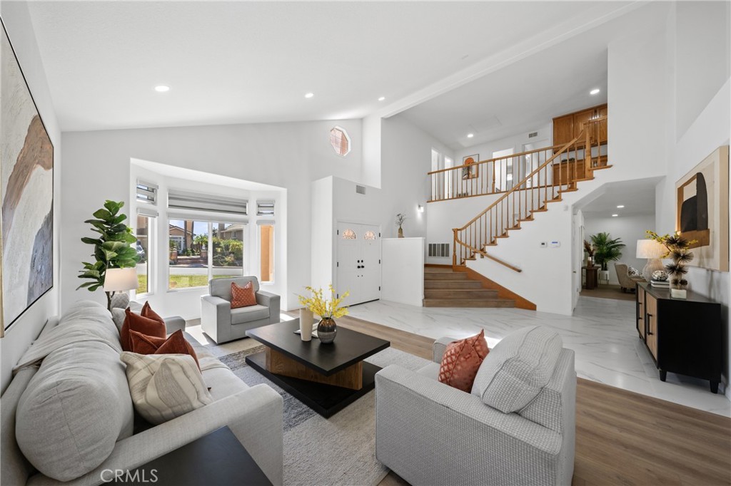 21111 Stockton Pass Road Walnut, CA 91789 - Photo 4 of 33 a living room with furniture and wooden floor