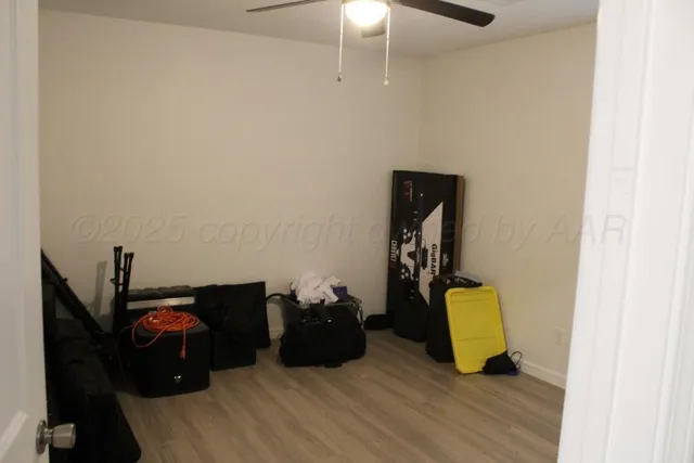 a room with a bed and a chandelier