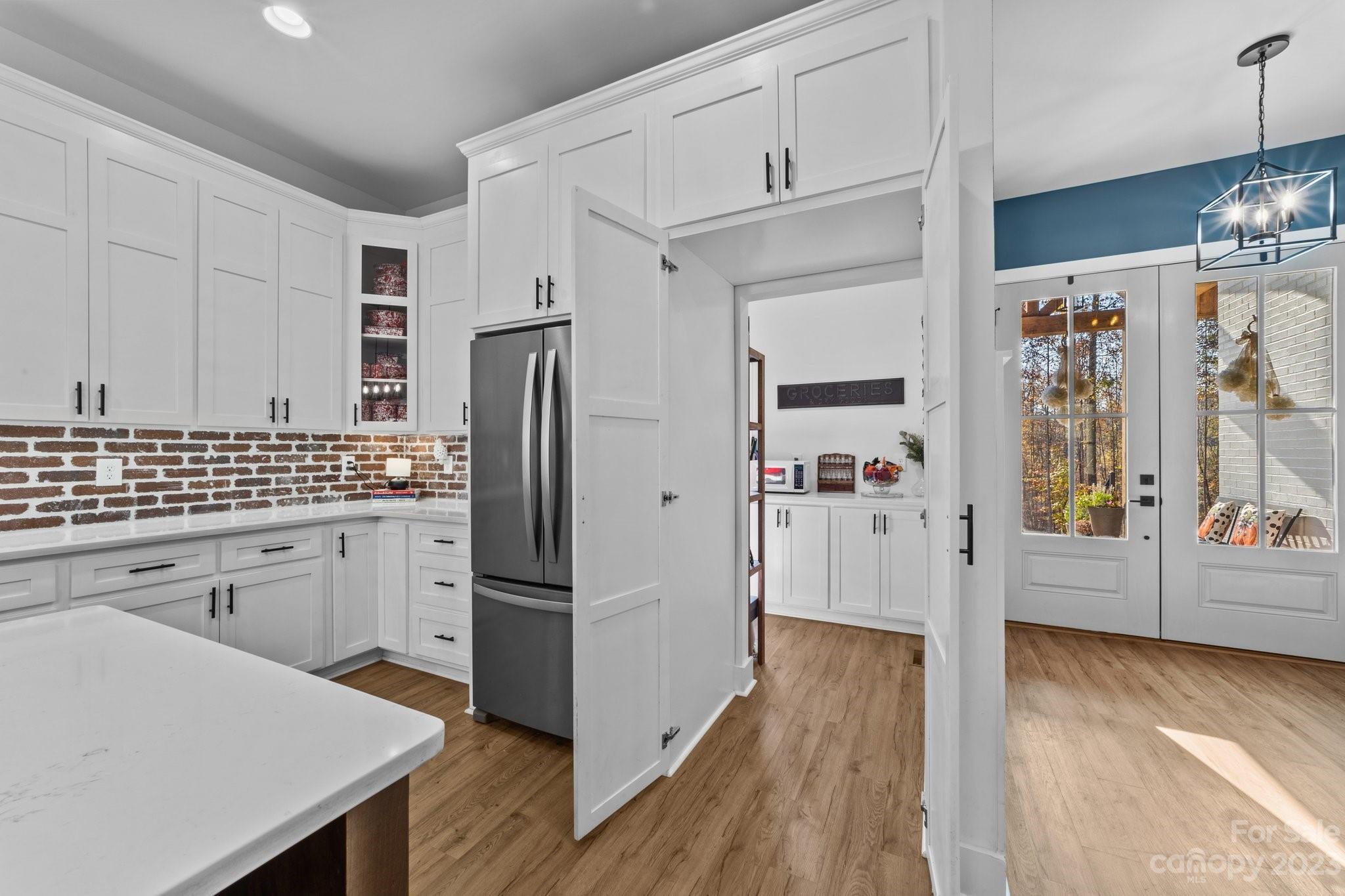 1490 Agner Road Salisbury, NC 28146 - Photo 12 of 47 a kitchen with stainless steel appliances a refrigerator sink and cabinets