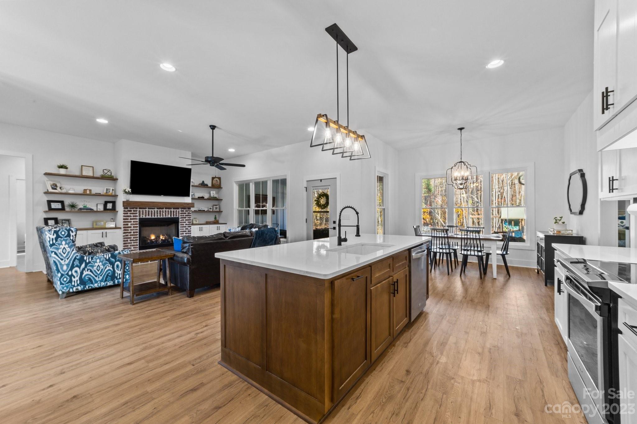 1490 Agner Road Salisbury, NC 28146 - Photo 14 of 47 a living room with furniture a fireplace and a flat screen tv