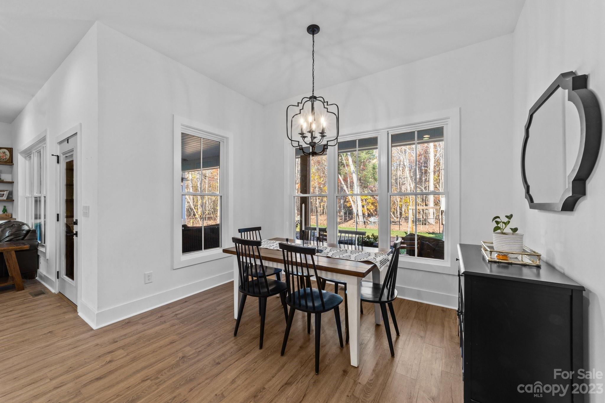 1490 Agner Road Salisbury, NC 28146 - Photo 16 of 47 a view of a dining room with furniture window and wooden floor