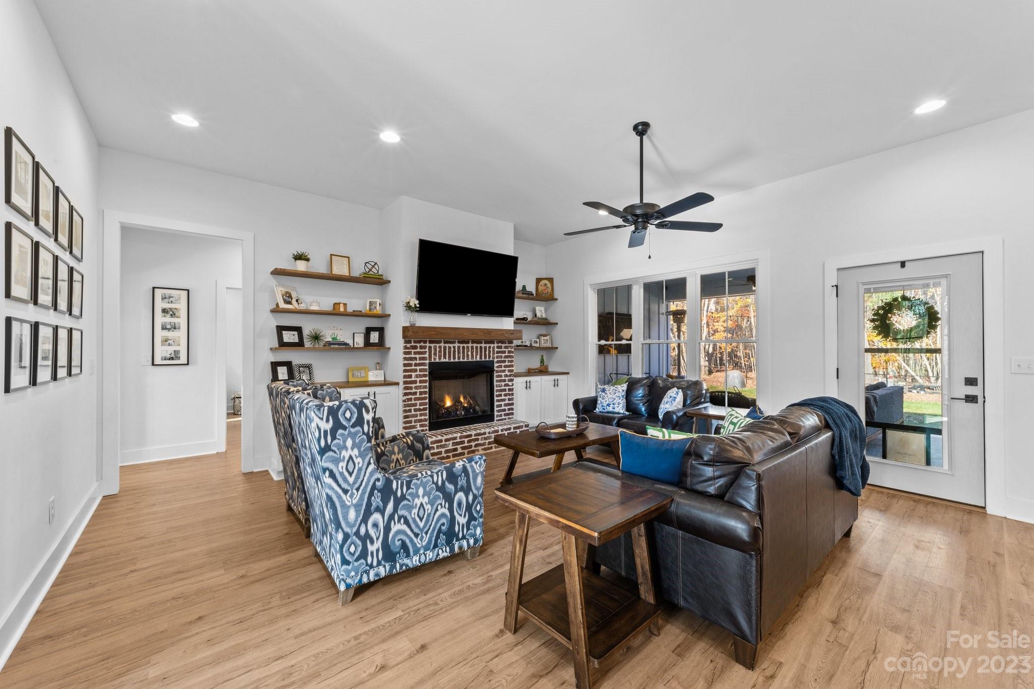 1490 Agner Road Salisbury, NC 28146 - Photo 18 of 47 a living room with furniture a fireplace and a flat screen tv