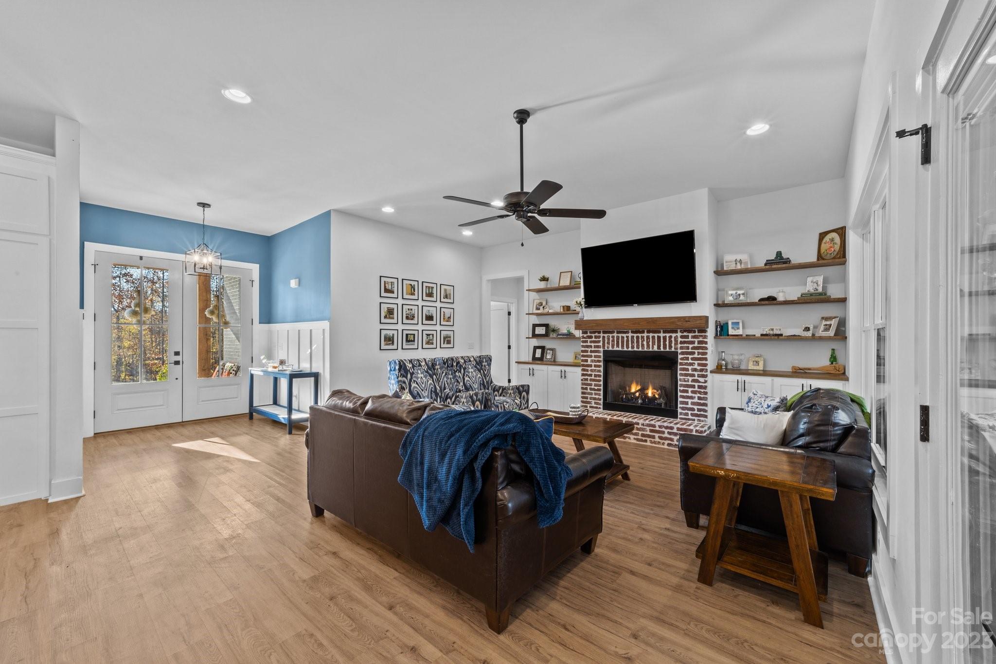 1490 Agner Road Salisbury, NC 28146 - Photo 19 of 47 a living room with furniture a fireplace and a flat screen tv