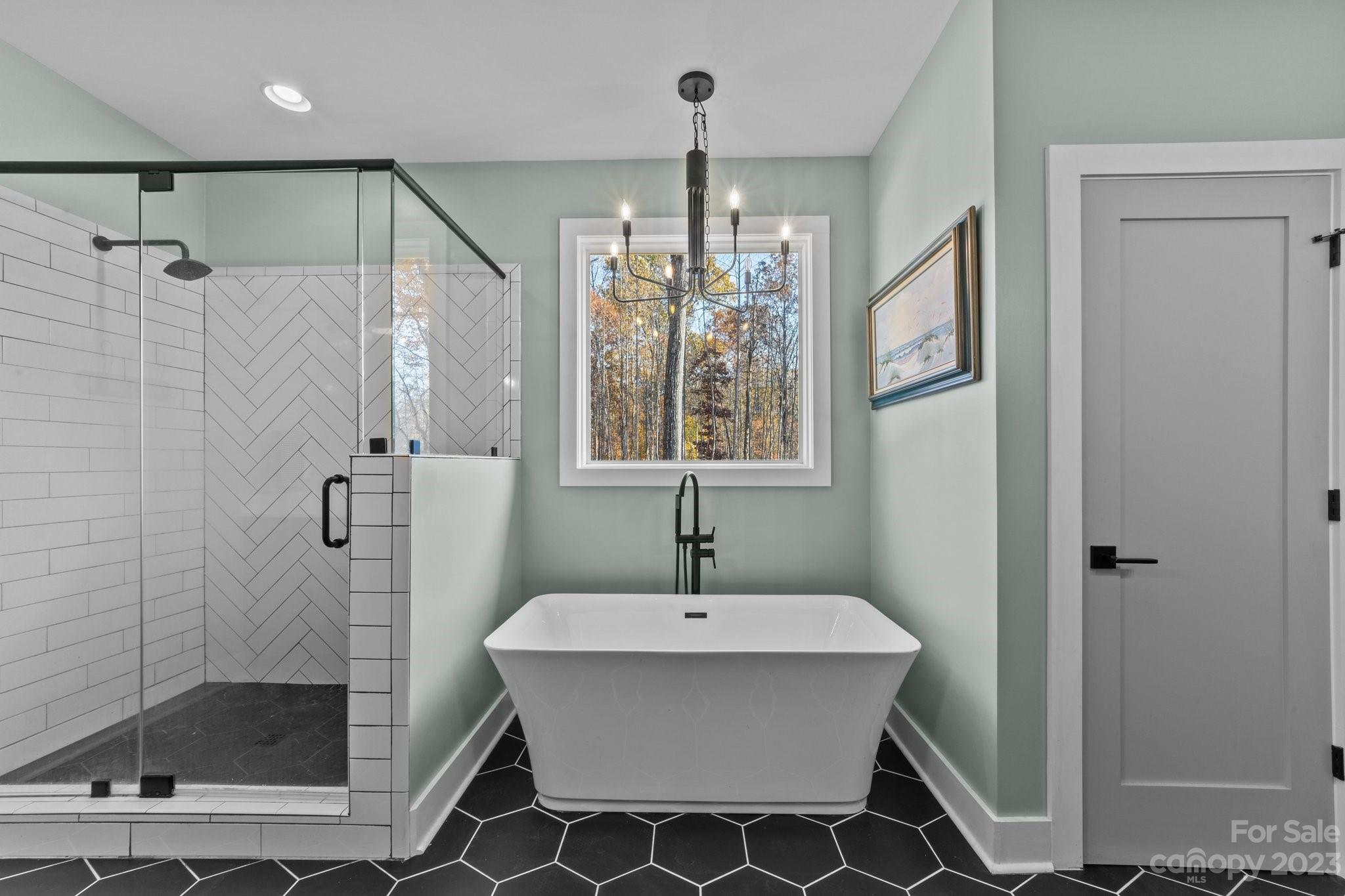 1490 Agner Road Salisbury, NC 28146 - Photo 22 of 47 a bathroom with a shower sink and mirror