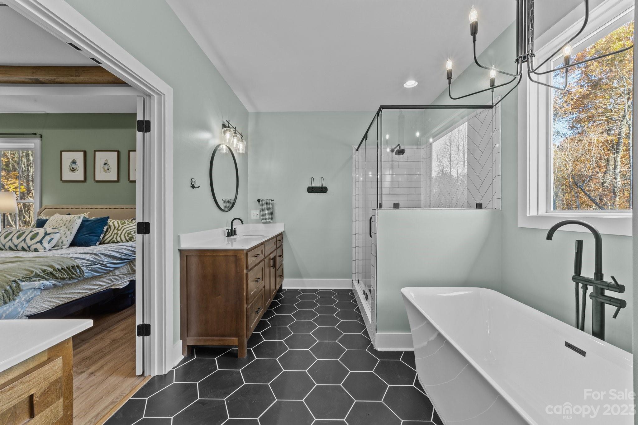 1490 Agner Road Salisbury, NC 28146 - Photo 23 of 47 a spacious bathroom with a double vanity sink a mirror and shower