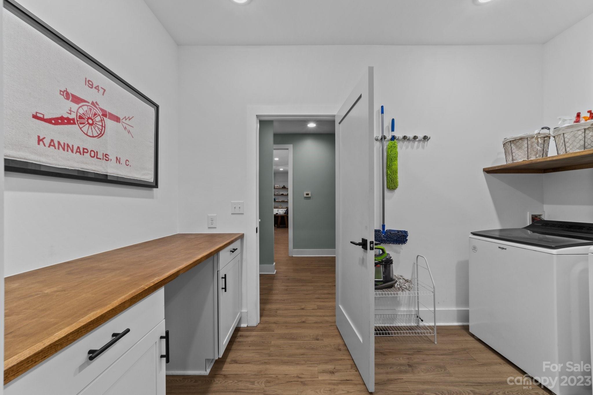 1490 Agner Road Salisbury, NC 28146 - Photo 27 of 47 a hallway with a white stove top oven and refrigerator