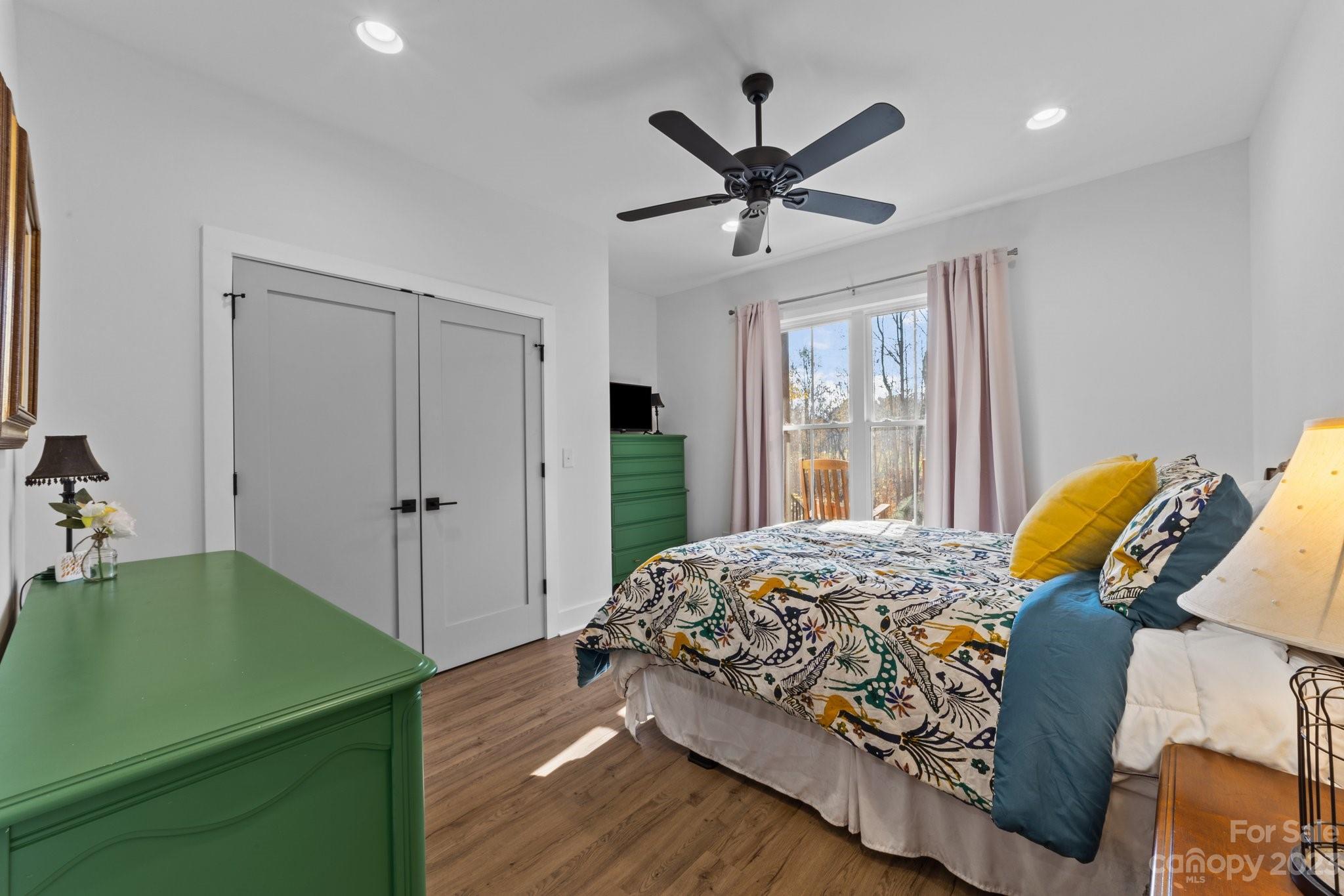 1490 Agner Road Salisbury, NC 28146 - Photo 28 of 47 a bedroom with a bed and a chandelier