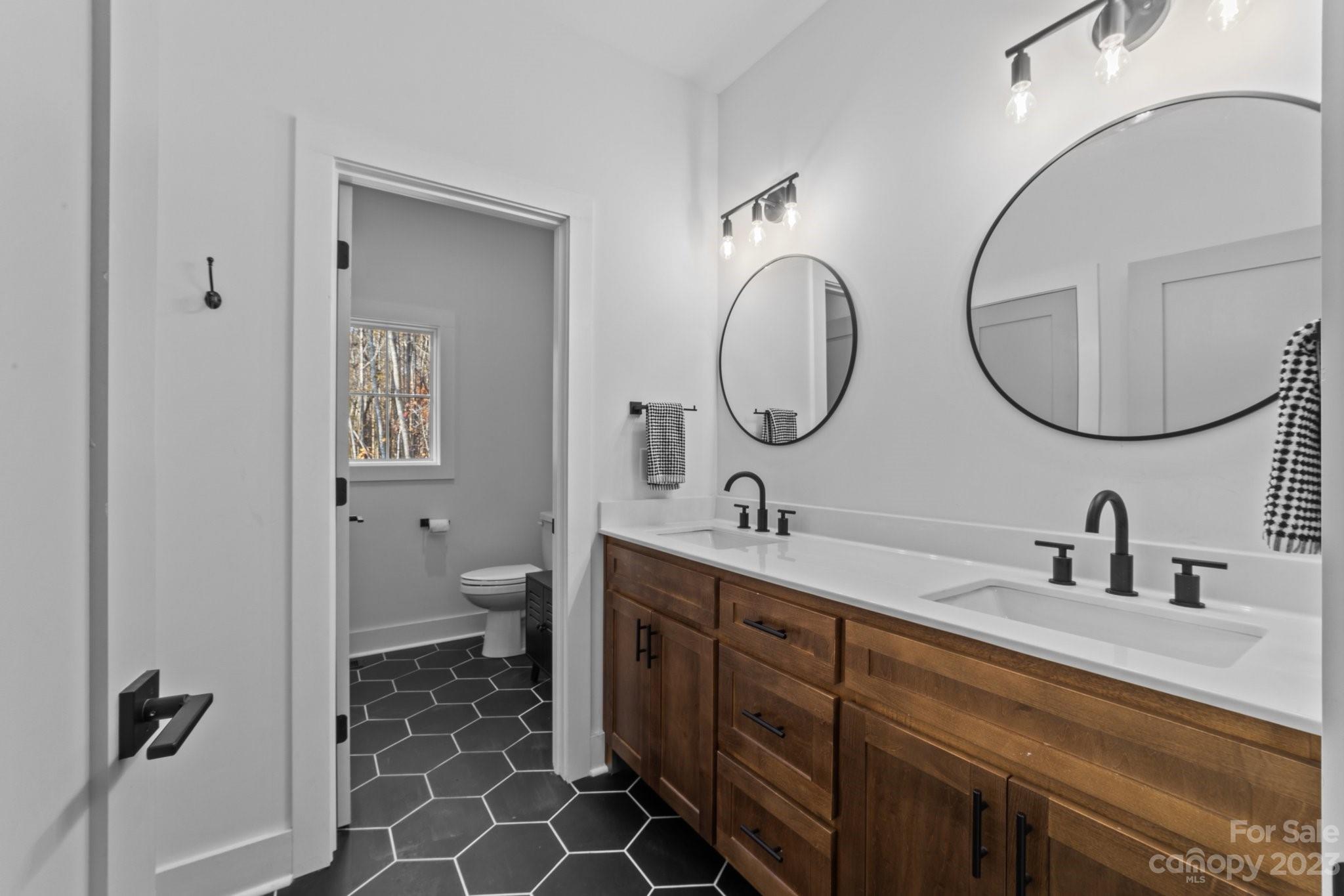 1490 Agner Road Salisbury, NC 28146 - Photo 32 of 47 a bathroom with a double vanity sink double and mirror