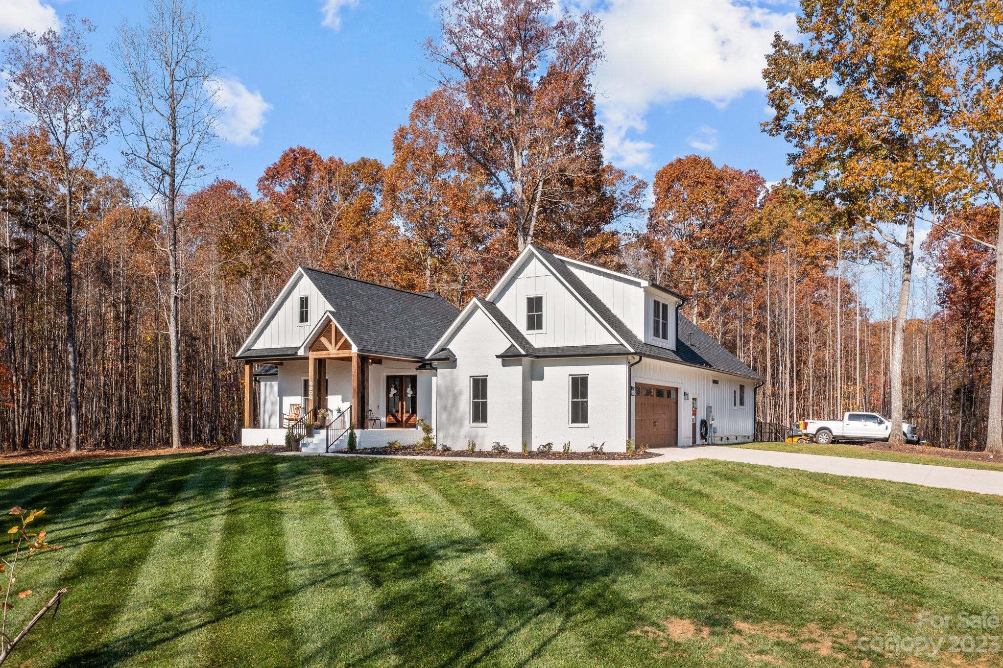 1490 Agner Road Salisbury, NC 28146 - Photo 46 of 47 a front view of a house with a yard table and chairs