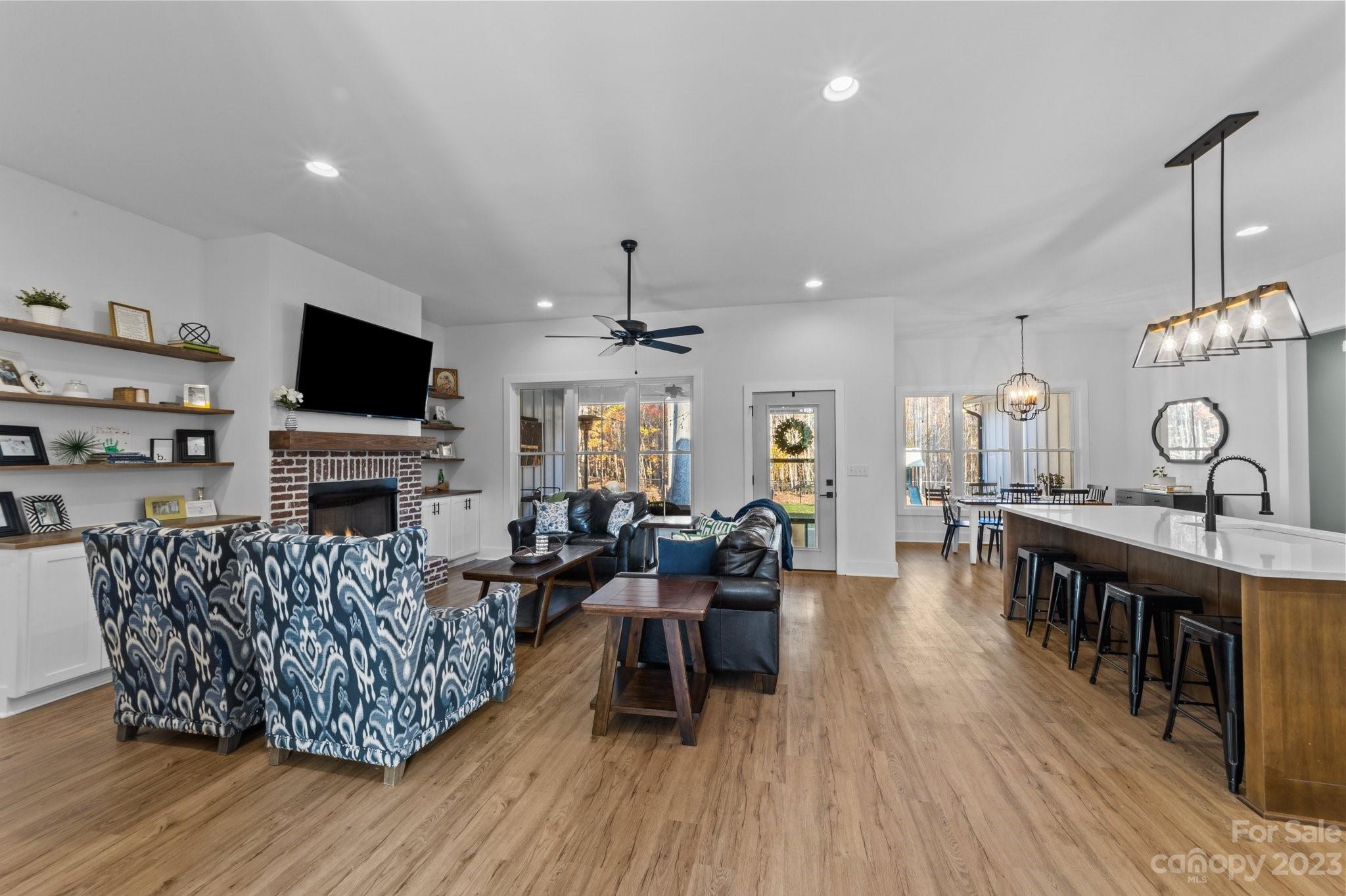 1490 Agner Road Salisbury, NC 28146 - Photo 8 of 47 a living room with furniture a fireplace and a flat screen tv