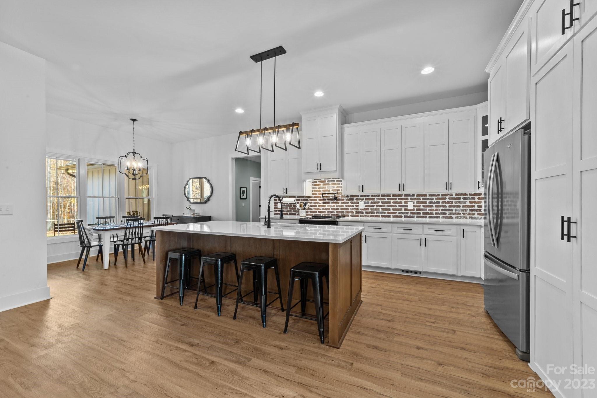 1490 Agner Road Salisbury, NC 28146 - Photo 9 of 47 a kitchen with a table chairs sink and cabinets