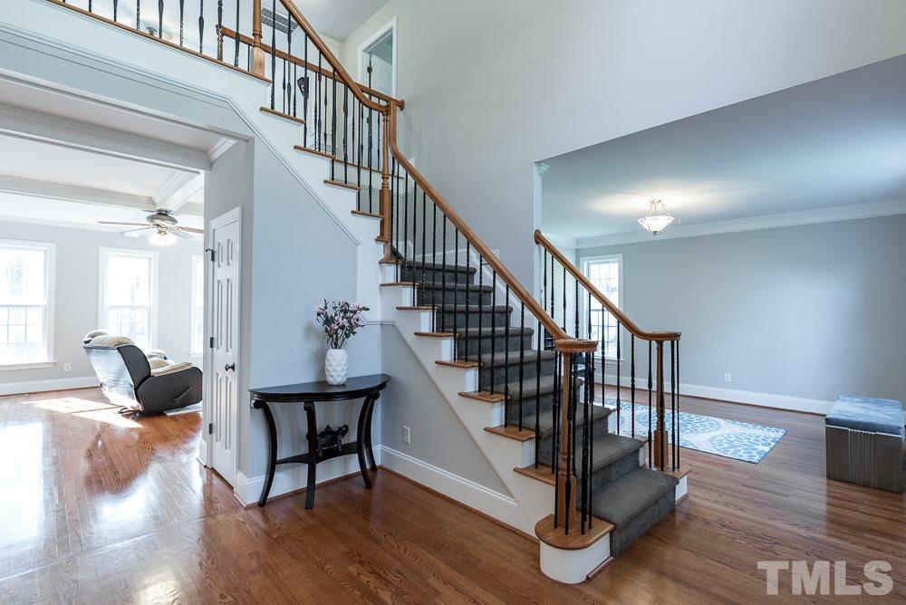 12708 Norwood Road Raleigh, NC 27613 - Photo 3 of 24 a view of entryway and hall with wooden floor