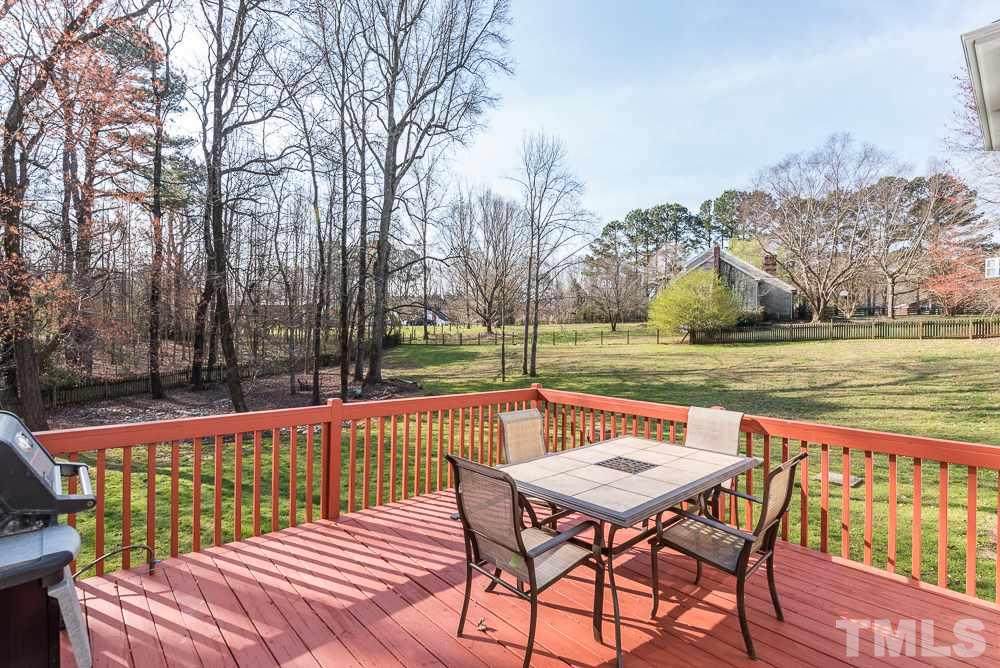 12708 Norwood Road Raleigh, NC 27613 - Photo 22 of 24 a view of a chairs and table on the roof deck