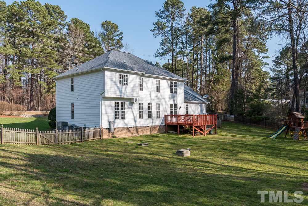 12708 Norwood Road Raleigh, NC 27613 - Photo 23 of 24 a front view of house with yard and green space