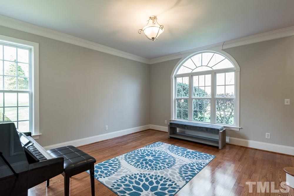 12708 Norwood Road Raleigh, NC 27613 - Photo 5 of 24 a living room with a couch and a window