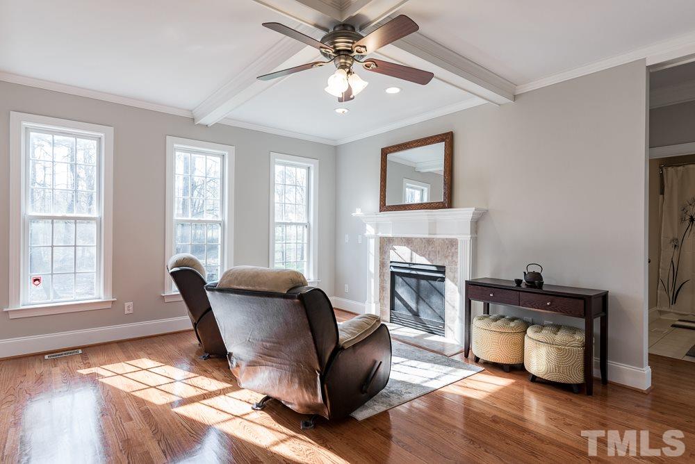 12708 Norwood Road Raleigh, NC 27613 - Photo 10 of 24 a living room with furniture and a fireplace