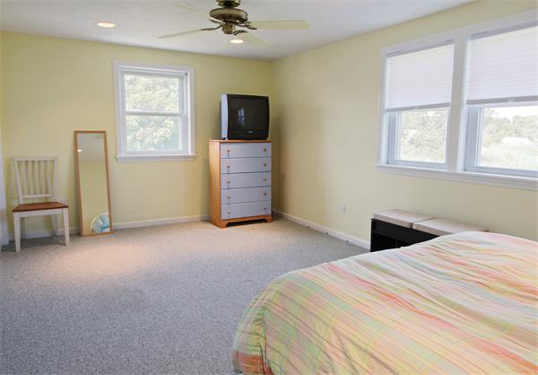 10 Cliff Estates Road, Unit 10 Scituate, MA 02066 - Photo 13 of 26 a bedroom with a bed and a television