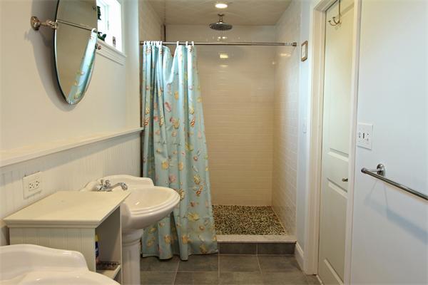 10 Cliff Estates Road, Unit 10 Scituate, MA 02066 - Photo 16 of 26 a bathroom with a sink a toilet and shower